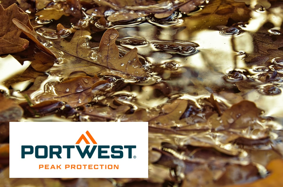 Image of a puddle with brown oak leaves. The logo of the manufacturer Portwest is in the bottom left of the image: white, rectangular background, blue and orange writing, orange double triangle. A link to the S5 Neptune Rigger CI FW75 safety shoe is provided.