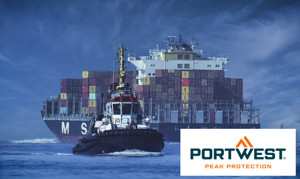 A container ship with colorful cargo containers is pulled by a tugboat through calm, blue water. The sky is a deep blue and the Portwest logo is displayed in the bottom right. A link to the collection of seaworthy clothing is provided.