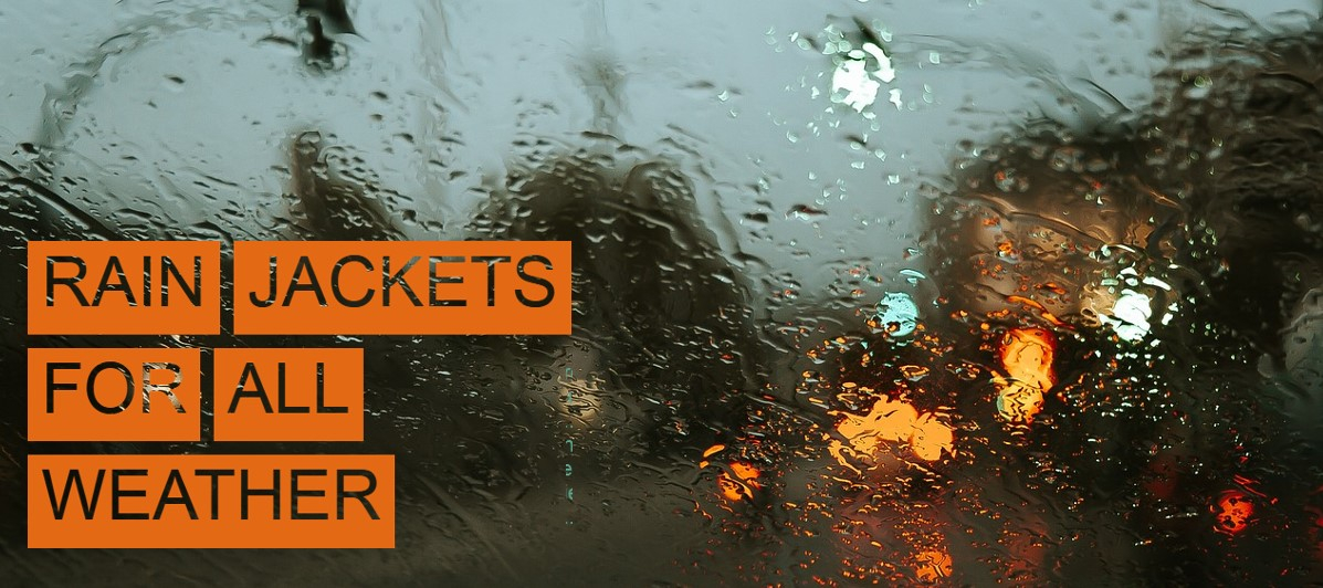 Street scene in the rain, photographed through a wet window. In the left edge of the picture is the heading "Rain jackets for all weathers" in punched-out, orange-backed letters.